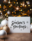 Festive 'Season's Greetings' greetings card with a simple design, perfect for sending holiday wishes.