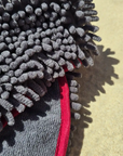 Close-up detail showing the super absorbent noodle texture of the Dolphin & Dog fast drying towel."