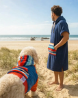 Dog and owner matching hoodie and hooded towel. dog is wearing a dog hoodie that matches the human hooded towel.