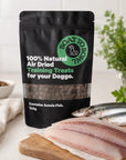 Boat To Bowl air-dried dog training treats displayed with fresh fish to show the Aussie fish ingredient source.
