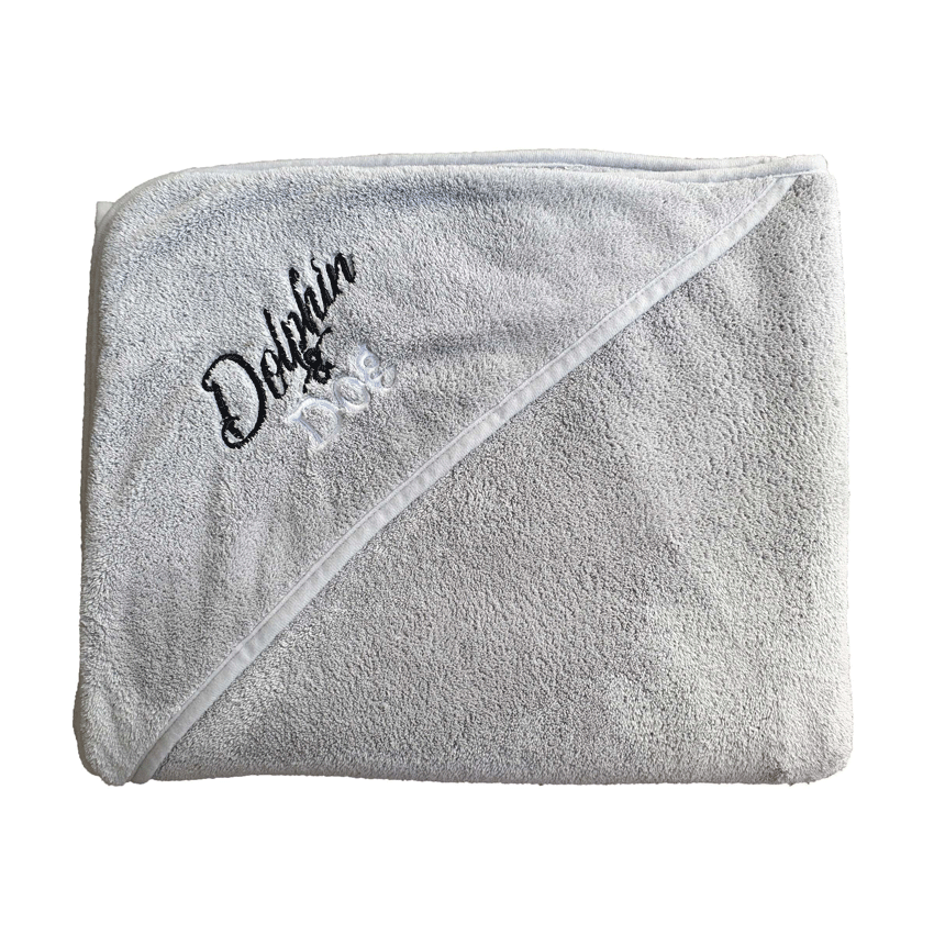 Dg towel folded up, pocket shows embroider of Dolphin and Dog brand 