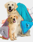 Two dogs being dried by the Dolphin & Dog towel range. Blue dog towel and Grey dog towel being used by the dog owners.