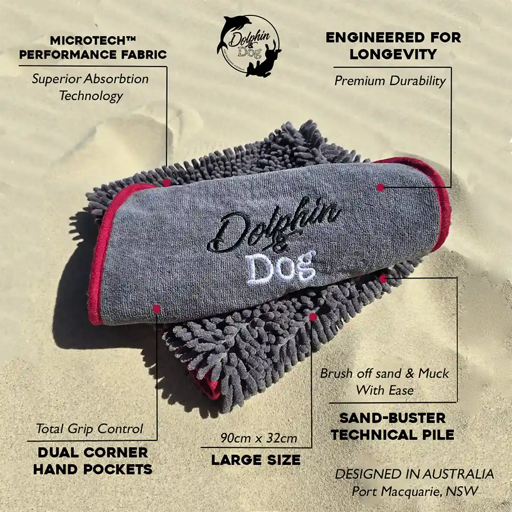 Dog towel with red accents on a sand background, featuring text about product features.