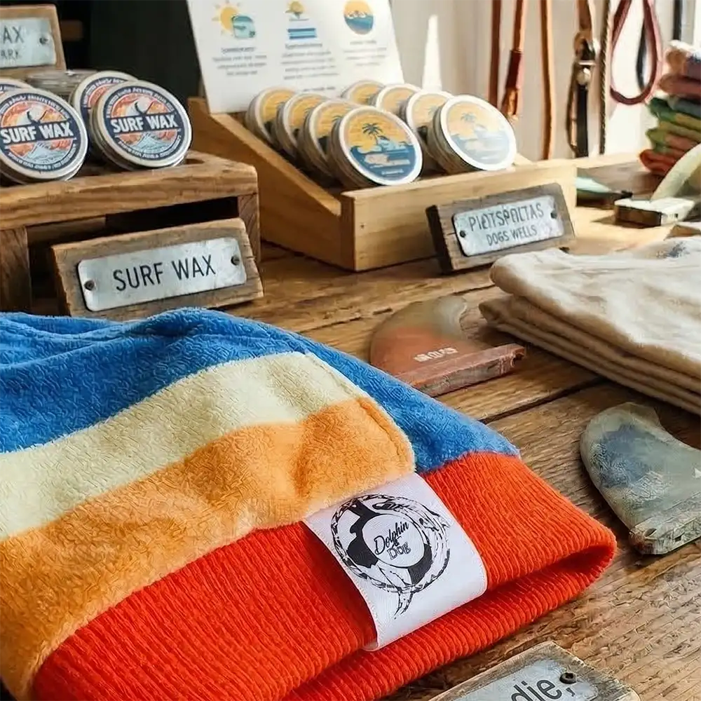a dog jumper on display on a table in a surf shop. 