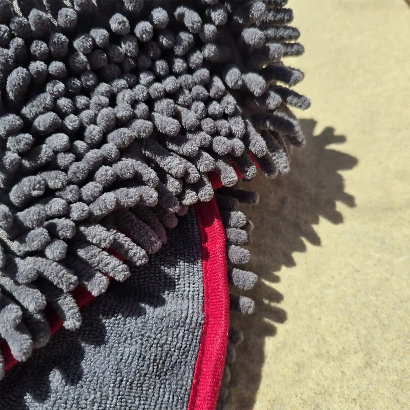 Close-up detail showing the super absorbent noodle texture of the Dolphin & Dog fast drying towel."