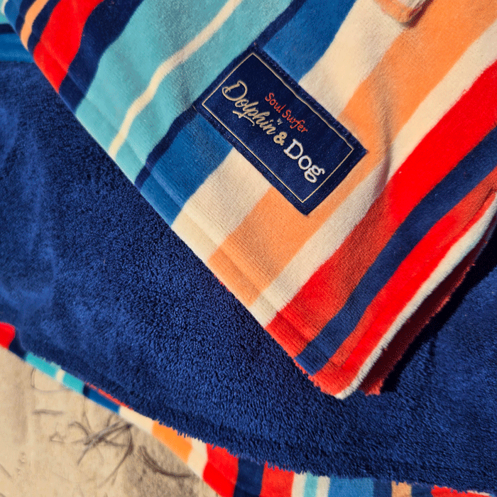 Close-up of the hooded towel with a brand label that says &quot;Dolphin and Dog&quot;